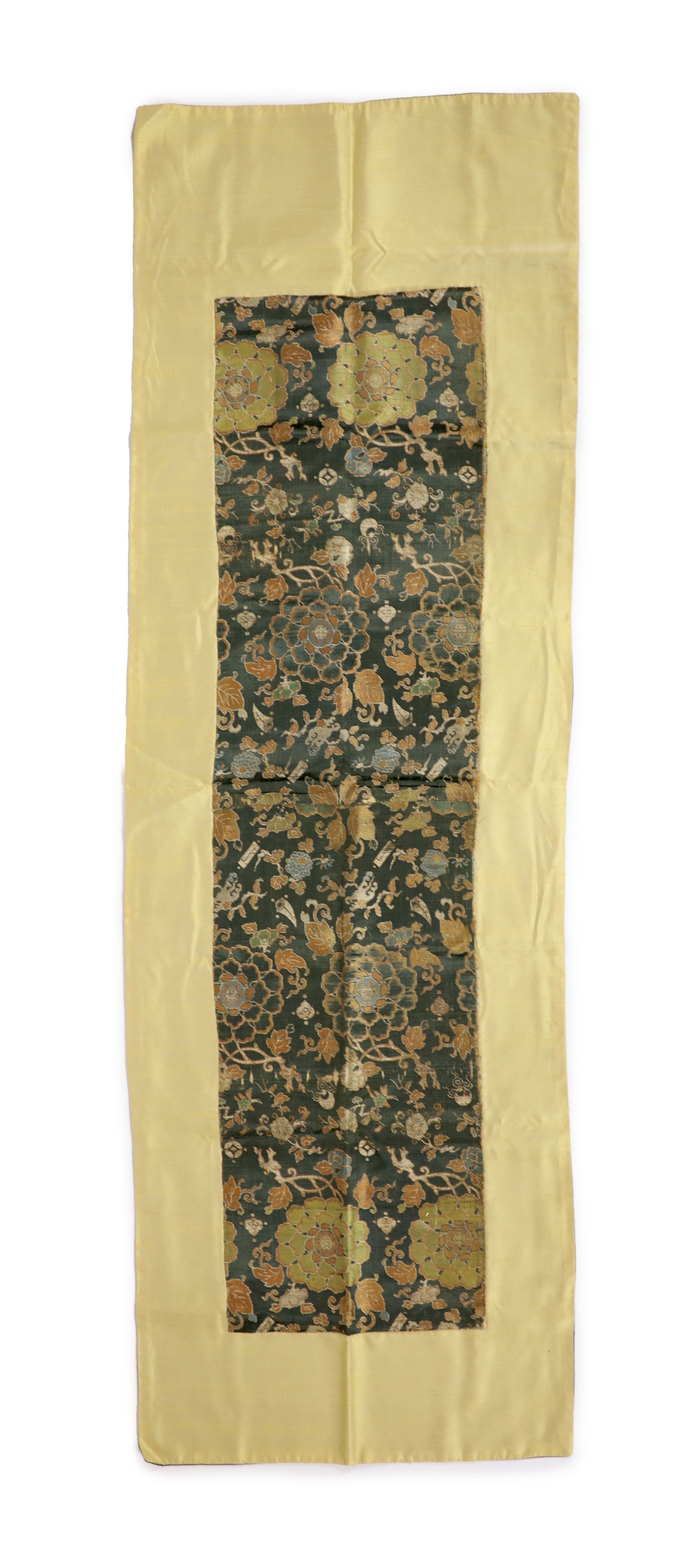 A Chinese brocade panel, 17th/18th century, Total size 169cm x 54cm